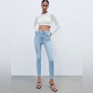 Zara light wash, high waist skinny jeans. Brand new w/tags, size 0.